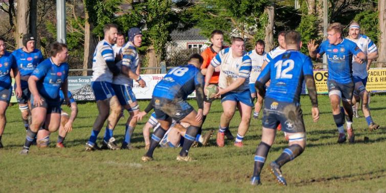 Iori Curtis gets the ball away for The Blues (Pic William John)